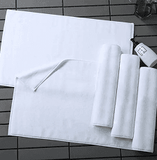 Crisp white thick cotton plain terry hotel bath mat
